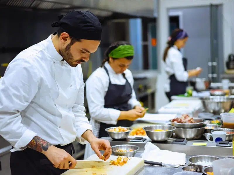 restaurant employees plating meals