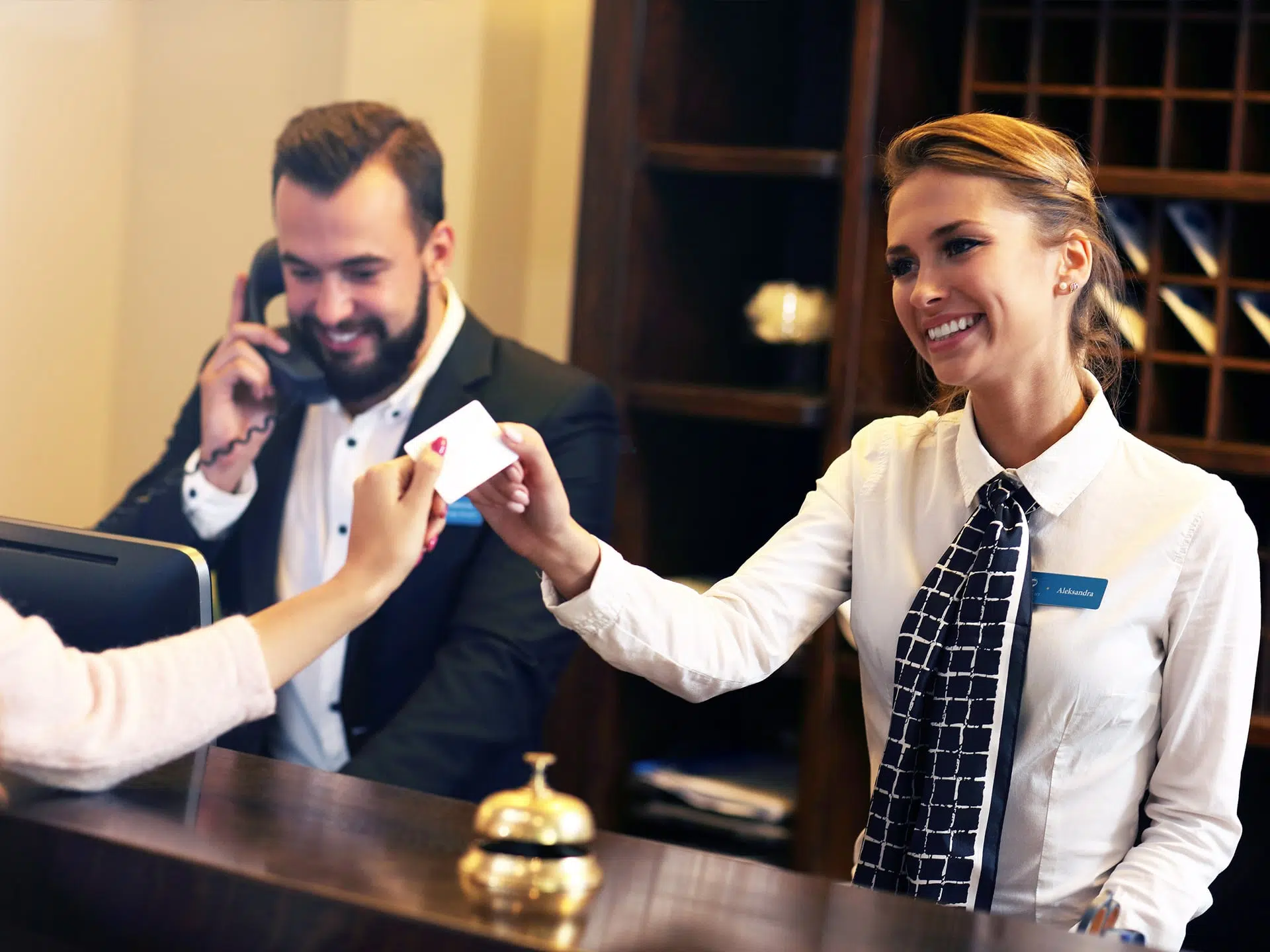 hotel workers helping customers