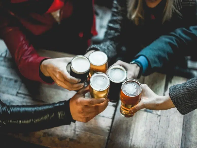 customers enjoying a beer in a bar