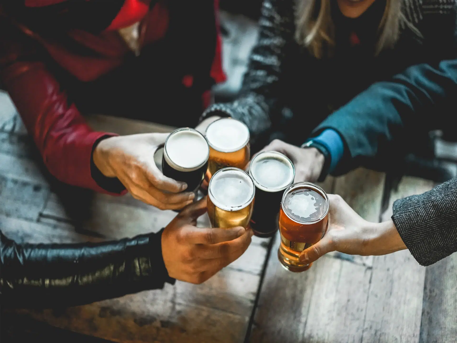 customers enjoying a beer in a bar
