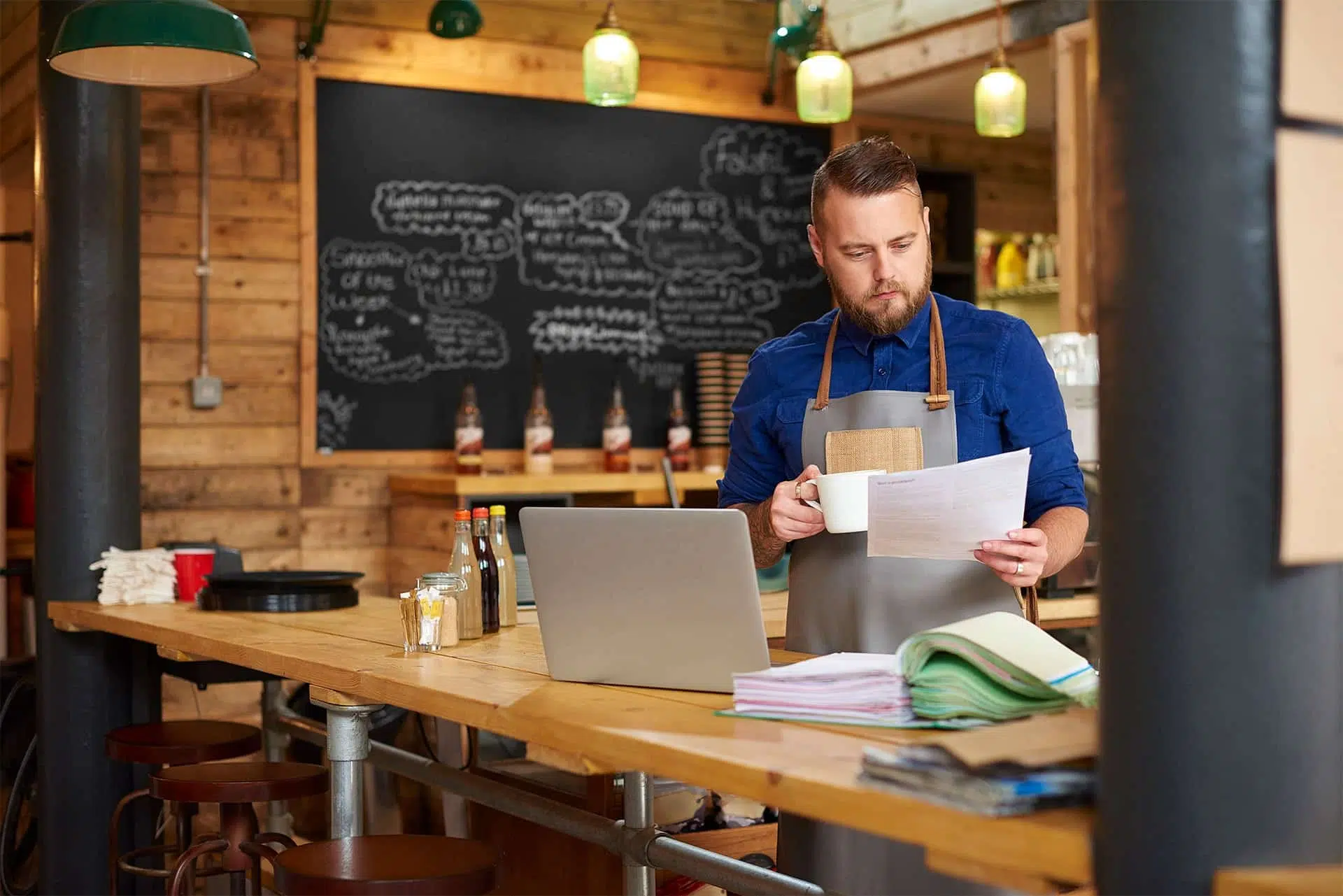 manager looking at resumes for hiring