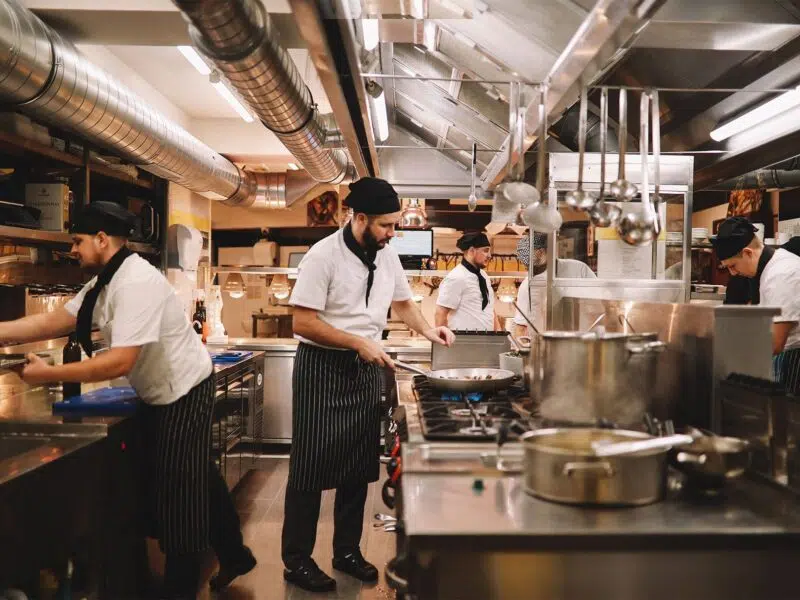 chefs working in a restaurant kitchen
