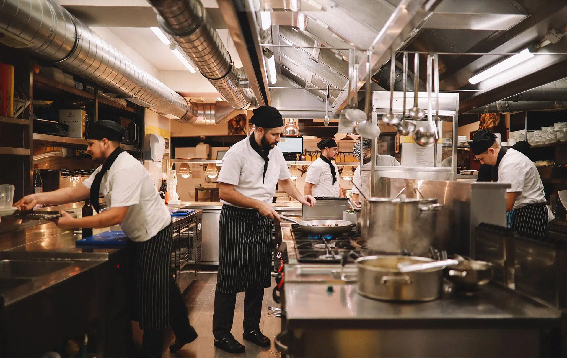 chefs working in a restaurant kitchen